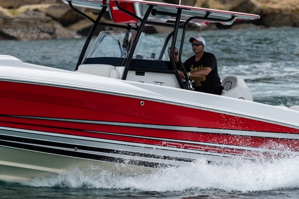 Renegade Power Boats- Man looking at open water ahead.