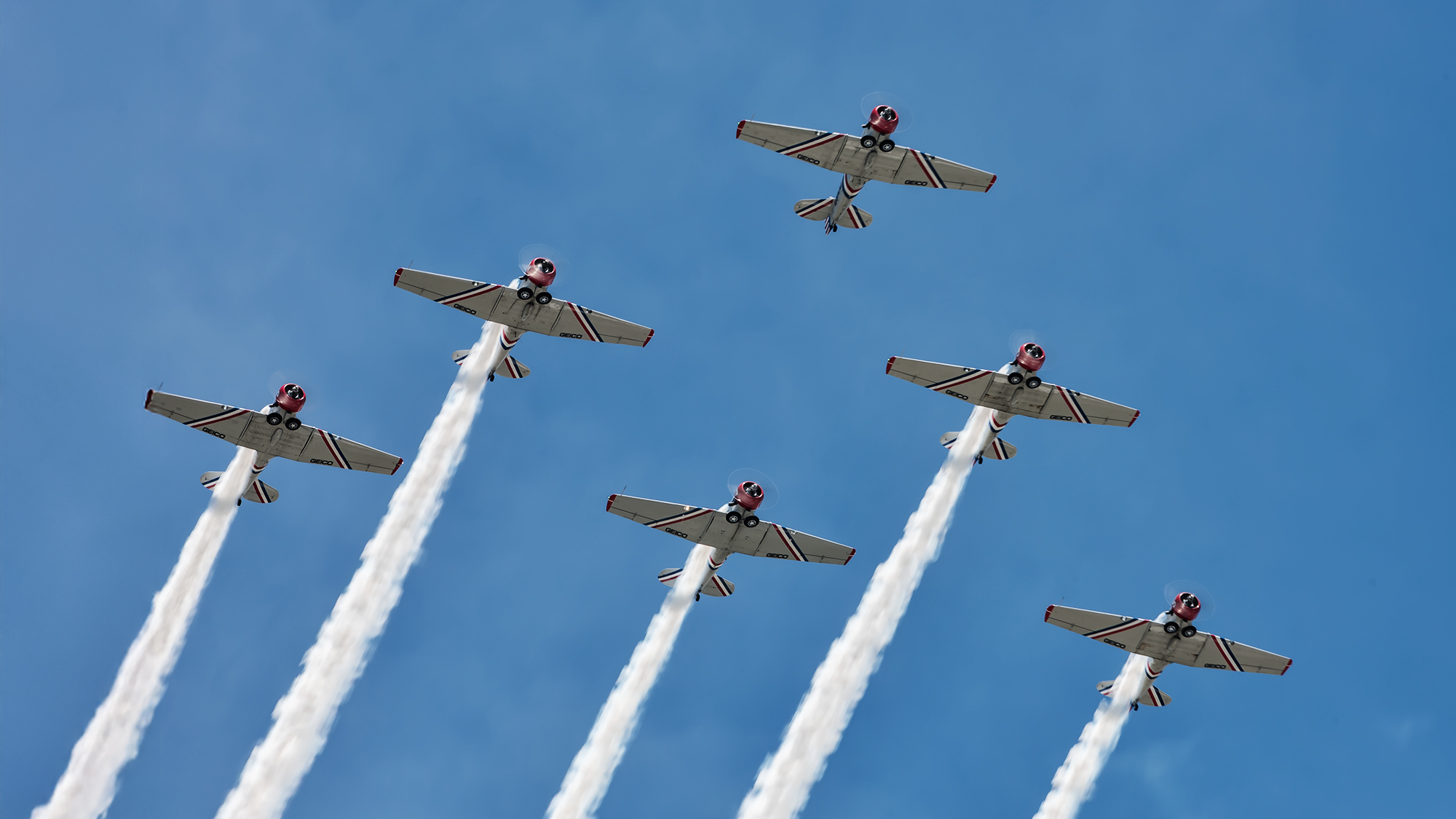 Geico Skytyper flyover with smoke trails