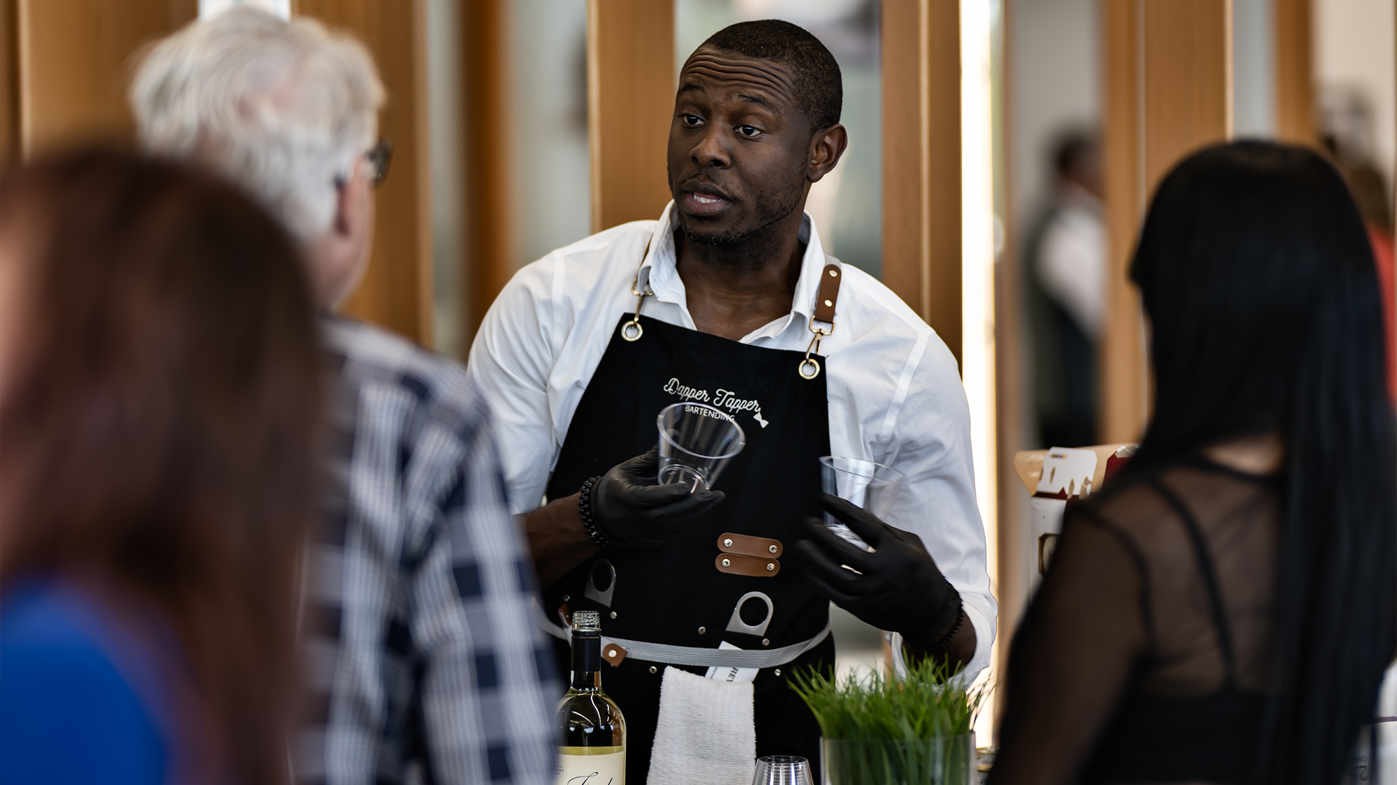 Bartender serving wine